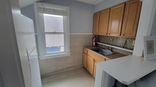 kitchen featuring sink and light tile patterned floors