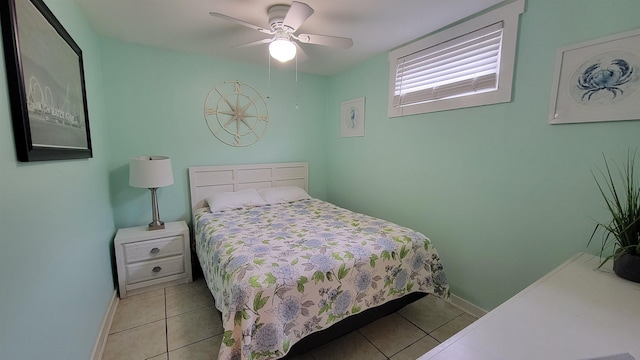 tiled bedroom with ceiling fan