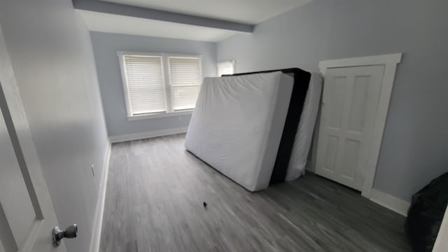 unfurnished bedroom with hardwood / wood-style flooring