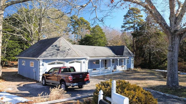 view of front of property with a garage and covered porch