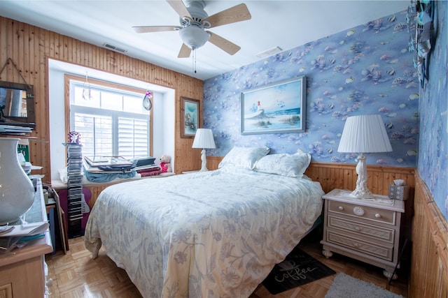 bedroom with ceiling fan and light parquet flooring