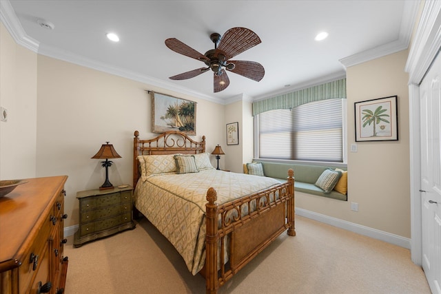 bedroom with ceiling fan, a closet, crown molding, and light carpet