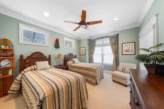 carpeted bedroom with ceiling fan and ornamental molding