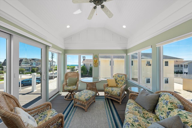 sunroom / solarium featuring ceiling fan and lofted ceiling