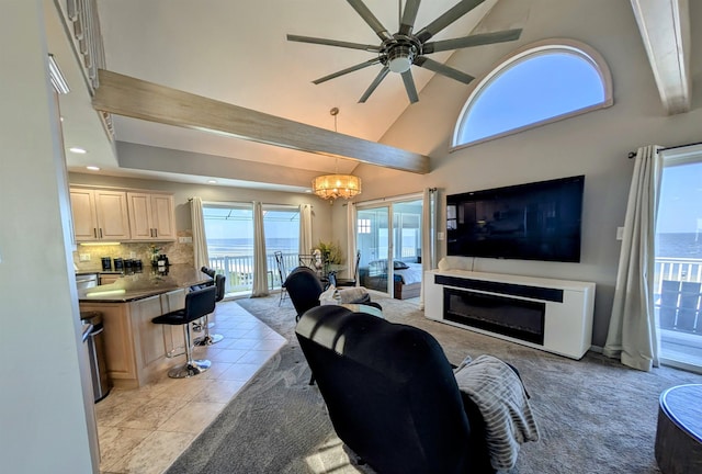 6 Pierces Point Rd, Cape May Court House, NJ 08210 - living room with a towering ceiling, ceiling fan, a chandelier, recessed lighting, and a glass covered fireplace