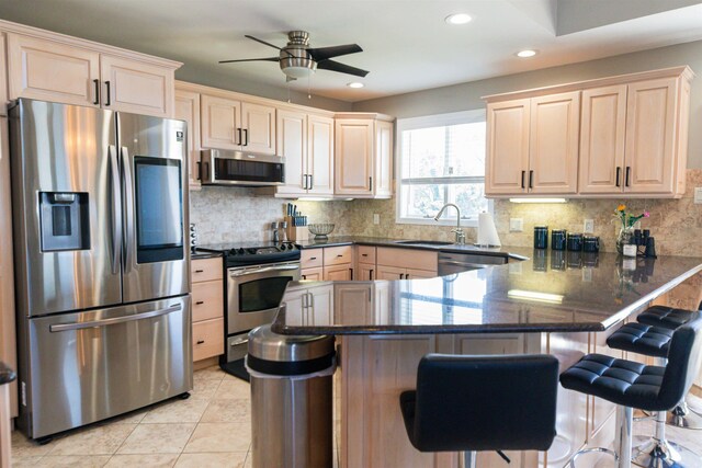 6 Pierces Point Rd, Cape May Court House, NJ 08210 - kitchen with stainless steel appliances, a peninsula, ceiling fan, backsplash, and recessed lighting