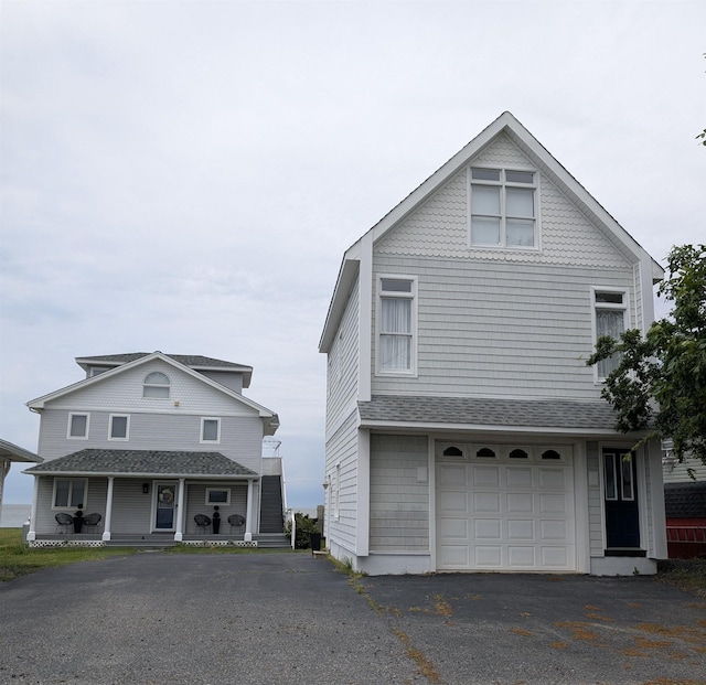 6 Pierces Point Rd, Cape May Court House, NJ 08210 - view of property exterior with driveway, an attached garage, covered porch, and roof with shingles