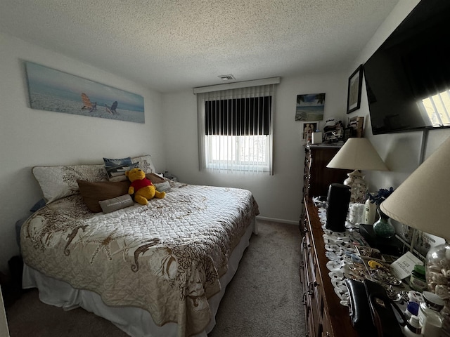 carpeted bedroom featuring a textured ceiling