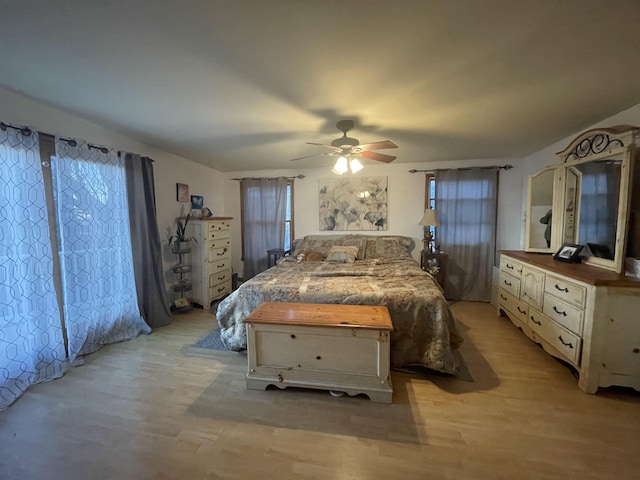 bedroom featuring light wood-type flooring and ceiling fan