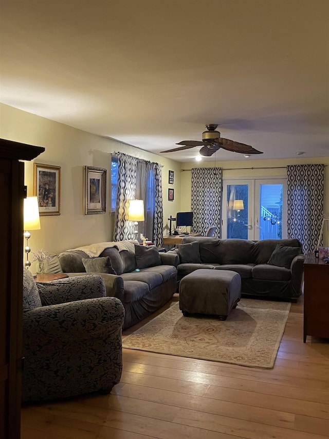 living room with hardwood / wood-style floors and ceiling fan