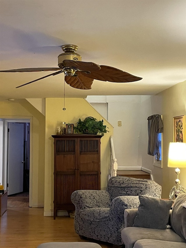 living room featuring hardwood / wood-style flooring and ceiling fan