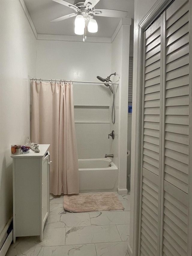 bathroom featuring ceiling fan, shower / bath combo with shower curtain, ornamental molding, and a baseboard heating unit