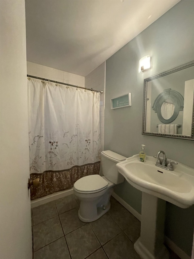 bathroom with tile patterned floors and toilet