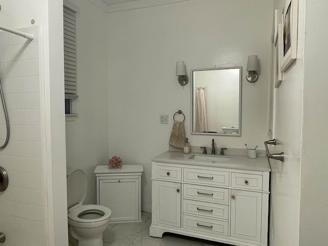 bathroom with vanity, toilet, walk in shower, and crown molding