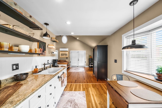 2068 N Shore Rd, Clermont, NJ 08210 - kitchen with open shelves, lofted ceiling, white cabinets, light wood-type flooring, and decorative light fixtures