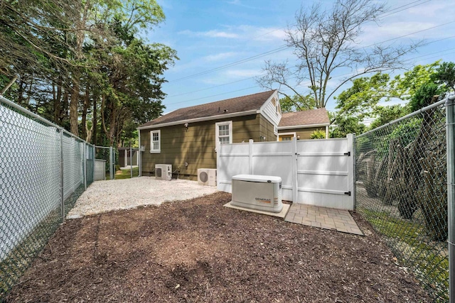 2068 N Shore Rd, Clermont, NJ 08210 - back of house with a gate, a fenced backyard, and a shingled roof