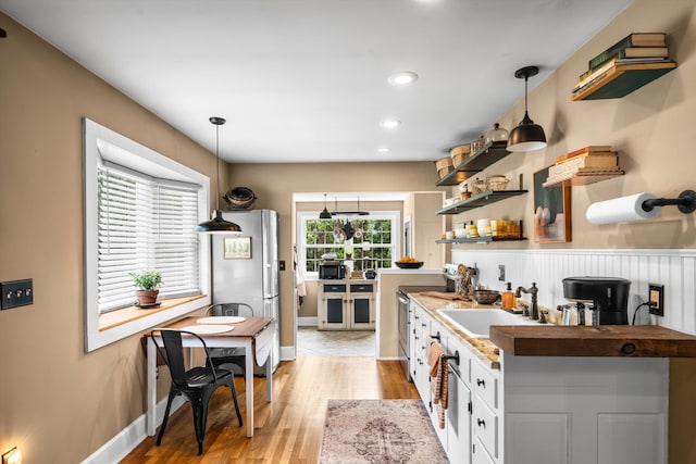 2068 N Shore Rd, Clermont, NJ 08210 - kitchen featuring freestanding refrigerator, light wood-style floors, pendant lighting, open shelves, and recessed lighting