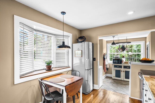 2068 N Shore Rd, Clermont, NJ 08210 - kitchen with appliances with stainless steel finishes, decorative light fixtures, wood finished floors, and light stone countertops