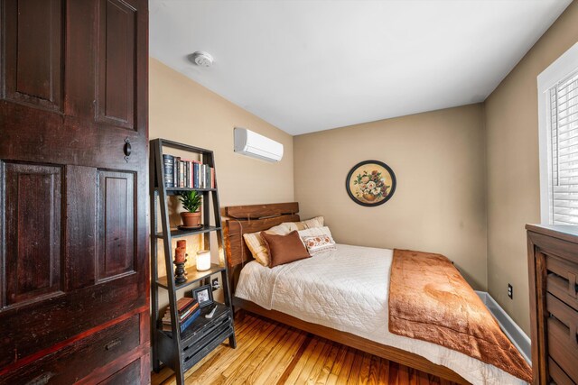2068 N Shore Rd, Clermont, NJ 08210 - bedroom featuring a wall mounted AC and light wood-type flooring