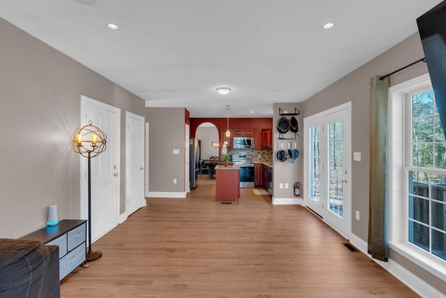 301 Pennsylvania Ave, Whitesboro, NJ 08210 - entrance foyer with light wood-type flooring, baseboards, recessed lighting, and arched walkways