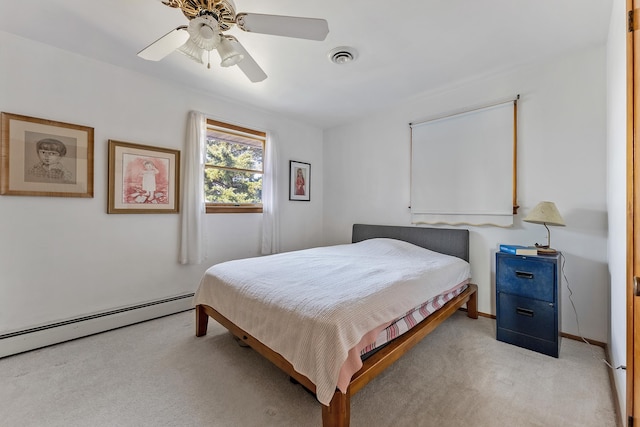 carpeted bedroom with ceiling fan and a baseboard radiator