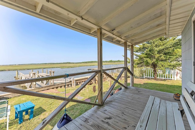 wooden deck featuring a water view