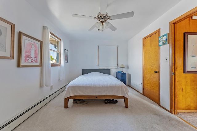 bedroom with light carpet, baseboard heating, and ceiling fan