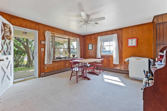 dining room with carpet flooring, ceiling fan, and baseboard heating