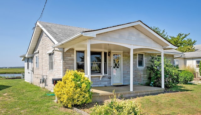 bungalow-style home featuring a front yard and a porch