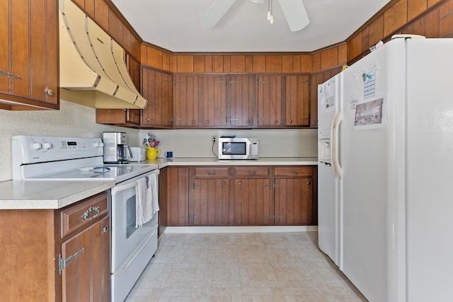 kitchen featuring white appliances, ventilation hood, and ceiling fan