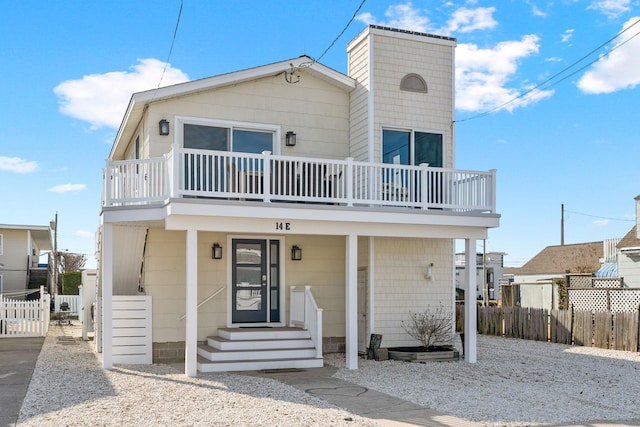 view of front of home with a balcony