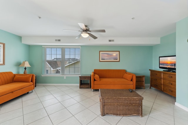 tiled living room with ceiling fan