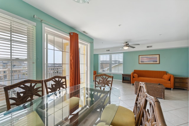 tiled dining area featuring ceiling fan