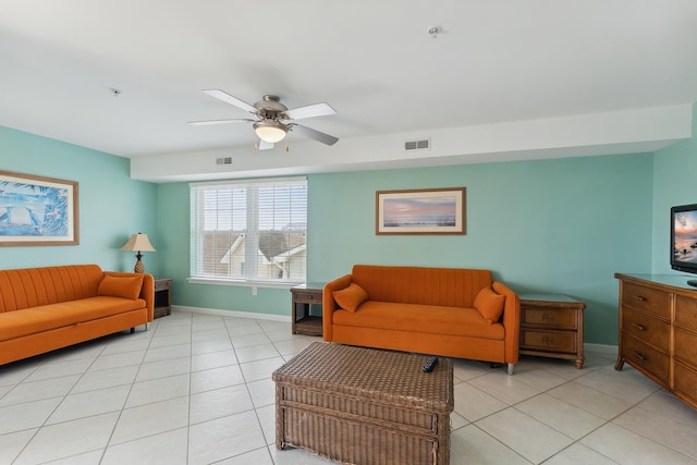 tiled living room featuring ceiling fan