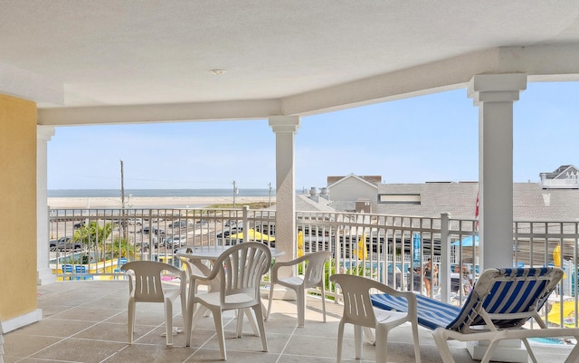 view of patio / terrace with a water view