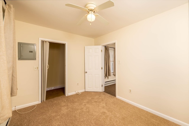 unfurnished bedroom featuring ceiling fan, a baseboard radiator, electric panel, light carpet, and a closet