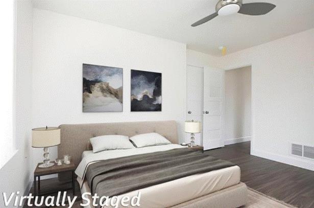 bedroom featuring hardwood / wood-style floors and ceiling fan