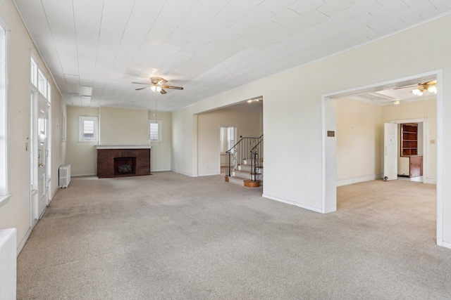 102 S Derby Ave, Ventnor, NJ 08406 - unfurnished living room featuring radiator, a ceiling fan, carpet flooring, a fireplace, and stairs