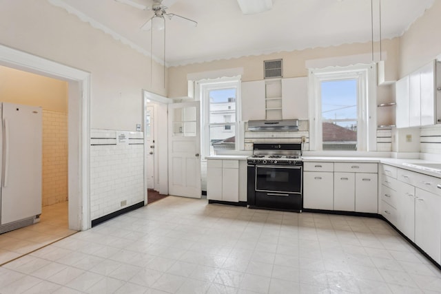 102 S Derby Ave, Ventnor, NJ 08406 - kitchen with gas range, freestanding refrigerator, healthy amount of natural light, and light countertops