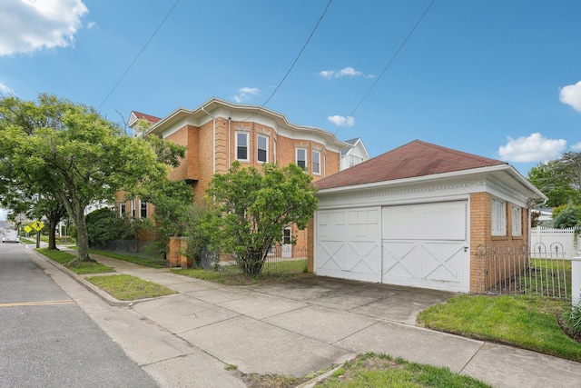 102 S Derby Ave, Ventnor, NJ 08406 - view of front of house with brick siding, a garage, and an outbuilding