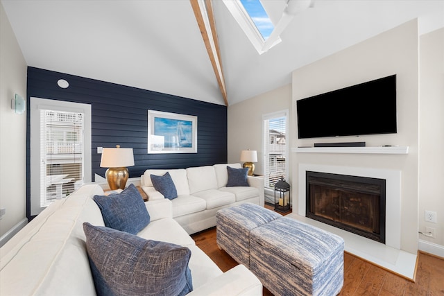 13 93rd St Unit 5, Stone Harbor, NJ 08247 - living room with a fireplace, wood finished floors, high vaulted ceiling, beamed ceiling, and wooden walls
