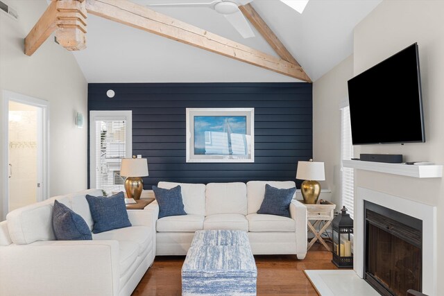 13 93rd St Unit 5, Stone Harbor, NJ 08247 - living room featuring wood finished floors, a fireplace with raised hearth, wooden walls, and ceiling fan