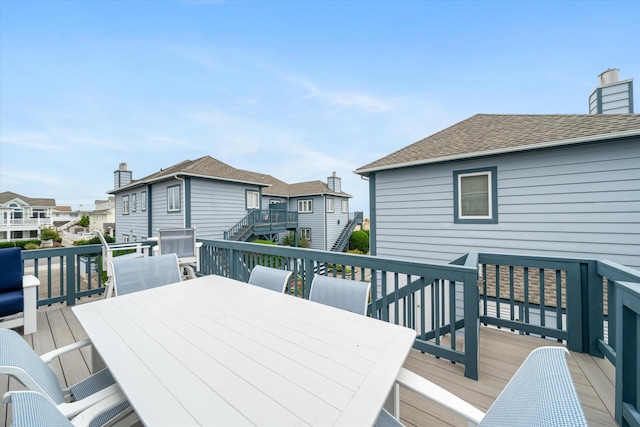 13 93rd St Unit 5, Stone Harbor, NJ 08247 - wooden terrace featuring outdoor dining area and a residential view