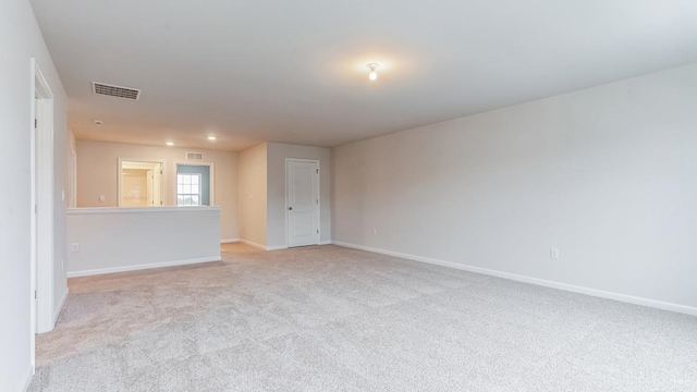 unfurnished room with light colored carpet