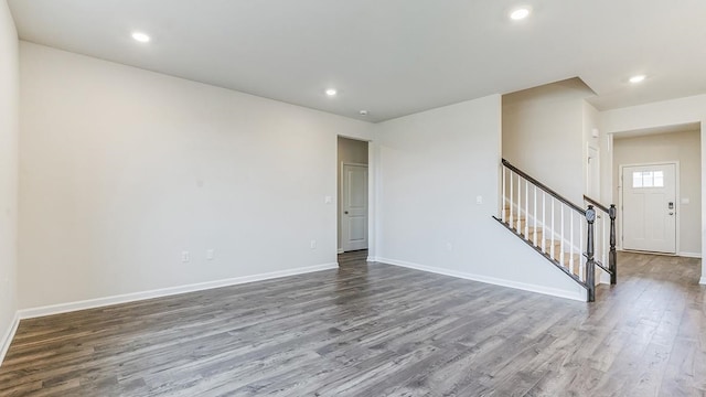 unfurnished room with wood-type flooring