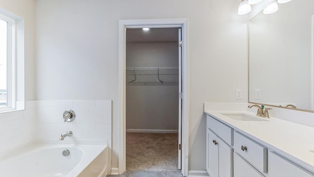 bathroom featuring a bathing tub and vanity