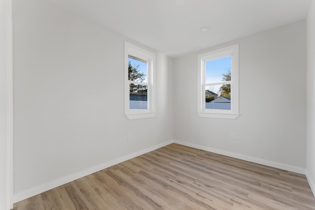 unfurnished room featuring light hardwood / wood-style flooring