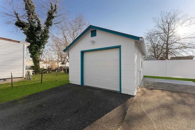 garage with a lawn