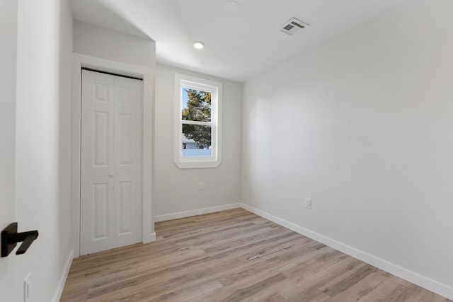 unfurnished bedroom featuring light hardwood / wood-style floors