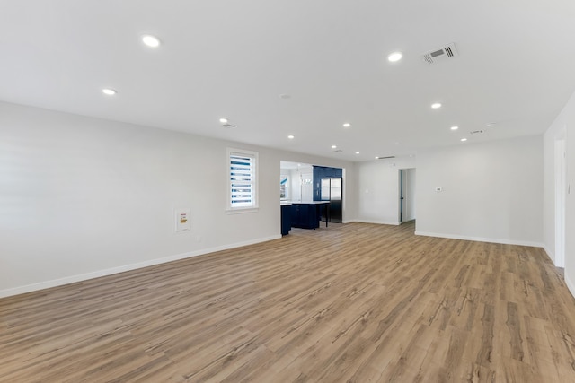 unfurnished living room featuring light hardwood / wood-style flooring